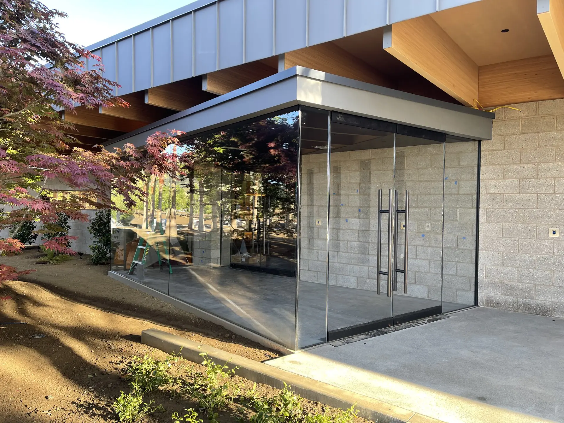 A building with glass doors and windows on the outside.
